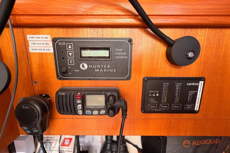 Slide: The Image of Control panel of a 2005 Hunter Passage 456 yacht with marine systems and radio. - 48