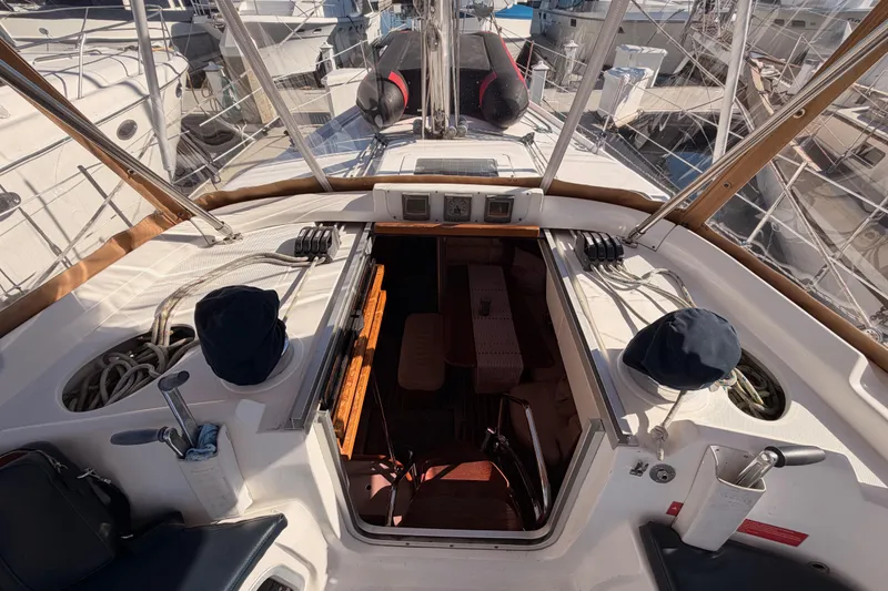 Slide: The Image of Cockpit view of 2005 Hunter Passage 456 sailboat, showcasing ropes and seating area. - 30