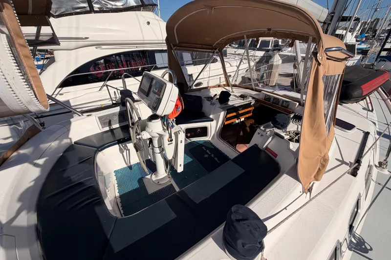 Slide: The Image of 2005 Hunter Passage 456 sailboat cockpit with navigation equipment and seating. - 13