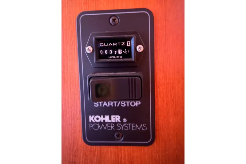 Slide: The Image of Kohler power system panel with hour meter on Hunter Passage 456, 2005 model. - 90