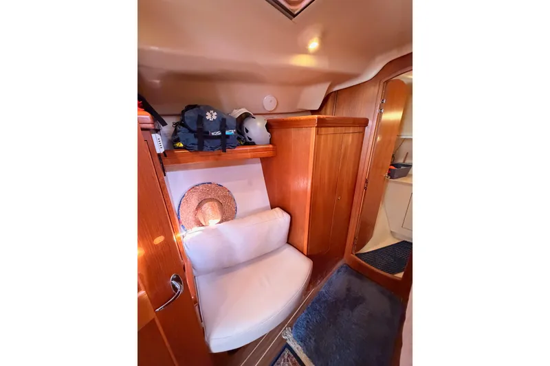 Slide: The Image of Interior of 2005 Hunter Passage 456 yacht with wooden cabinetry and seating area. - 56