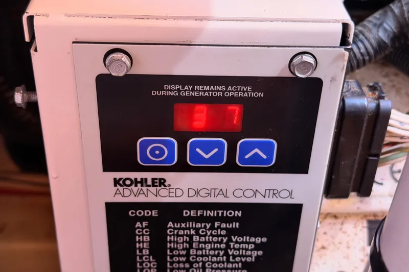 Slide: The Image of Kohler advanced digital control panel on a 2005 Hunter Passage 456 yacht. - 89