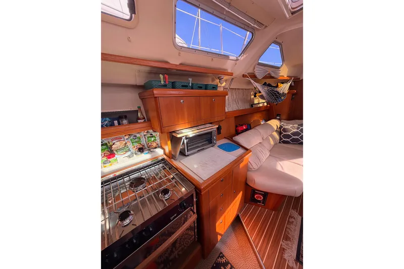 Slide: The Image of Interior of 2005 Hunter Passage 456 yacht with cozy seating and kitchen area. - 41