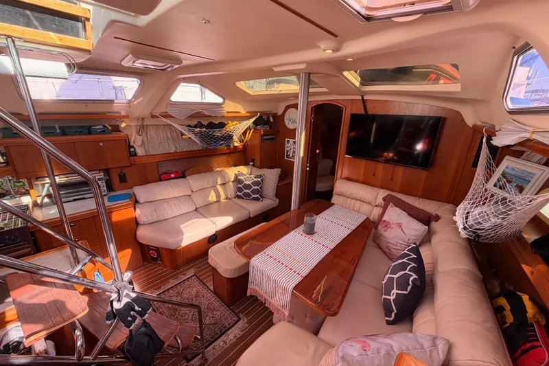 Slide: The Image of Luxurious interior of 2005 Hunter Passage 456 yacht with cozy seating and elegant decor. - 49