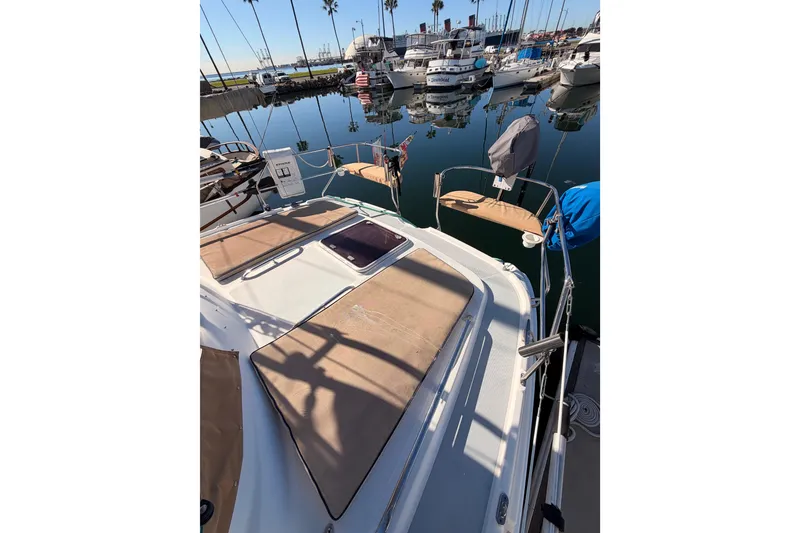 Slide: The Image of 2005 Hunter Passage 456 sailboat docked in a marina with calm waters. - 25