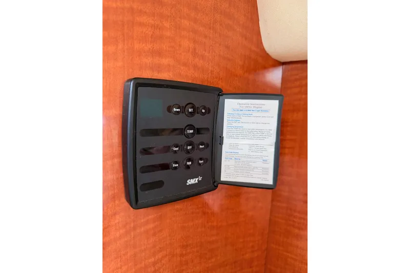 Slide: The Image of SMXir control panel on 2005 Sea Ray 300 Sundancer boat interior. - 35