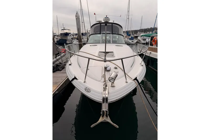 Slide: The Image of 2005 Sea Ray 300 Sundancer docked at marina, front view with anchor. - 1