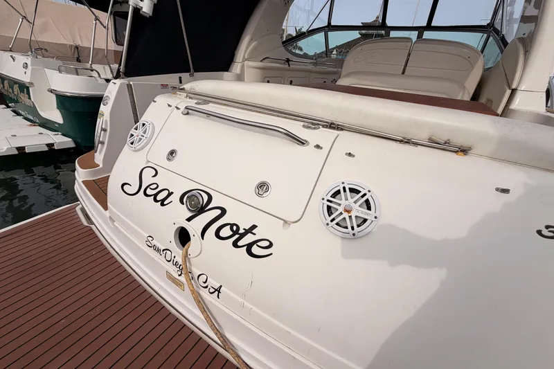 Slide: The Image of 2005 Sea Ray 300 Sundancer boat docked, featuring "Sea Note" name and San Diego, CA location. - 8