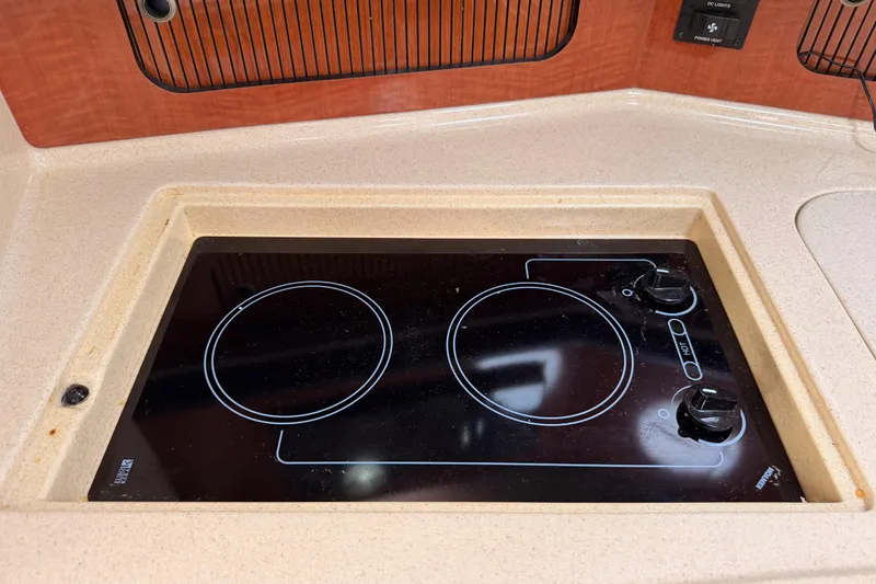 Slide: The Image of Built-in electric stove on 2005 Sea Ray 300 Sundancer yacht kitchen countertop. - 30