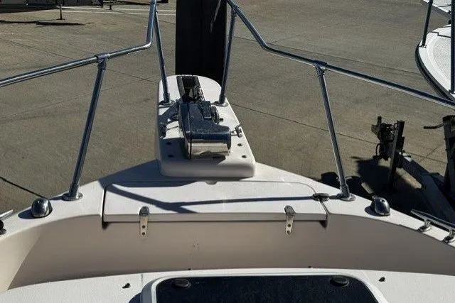 Slide: The Image of Bow view of 2004 Grady-White Gulfstream 232 boat, featuring anchor and railing. - 20