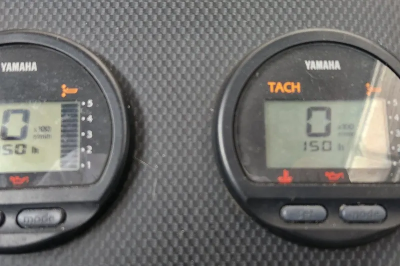 Slide: The Image of Yamaha tachometer display on 2004 Grady White 232 Gulfstream boat dashboard. - 14