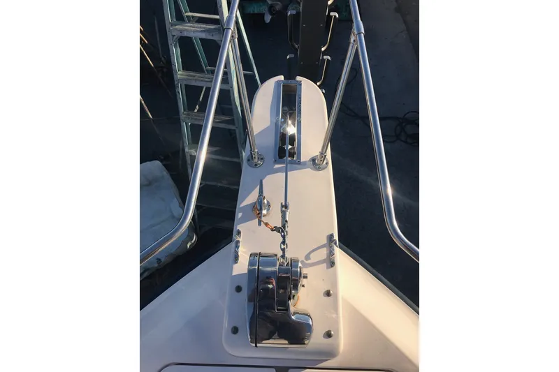Slide: The Image of Bow view of 2004 Grady White 232 Gulfstream boat with anchor chain and railing. - 13