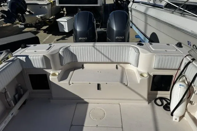 Slide: The Image of 2004 Grady-White Gulfstream 232 boat deck with twin 200 horsepower engines. - 18