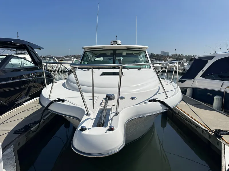 Slide: The Image of A 2007 Tiara Yachts 3000 Open docked in a marina, surrounded by other boats. - 53