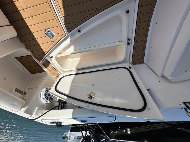Slide: The Image of The image shows the deck of a 2007 Tiara Yachts 3000 Open with storage and a speaker. - 45