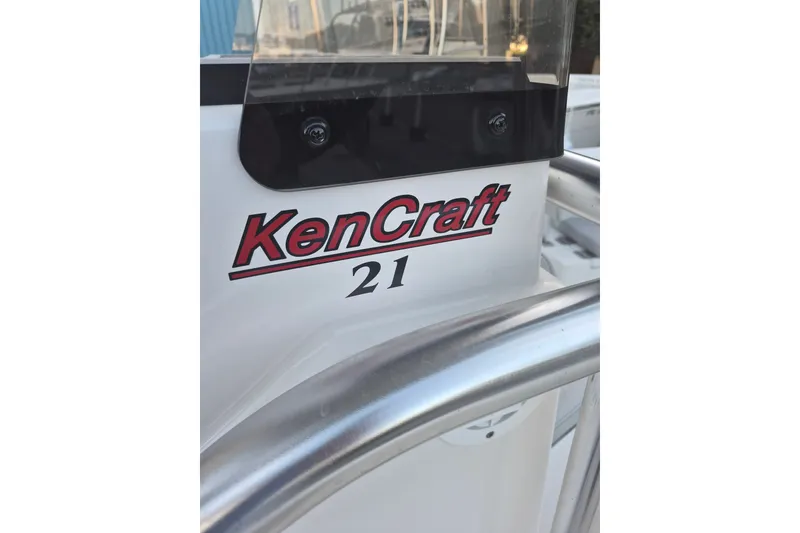 Slide: The Image of 2024 KenCraft 215 Center Console boat with logo and railing detail. - 16