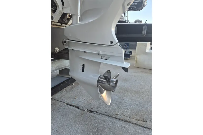 Slide: The Image of 2024 KenCraft 215 Center Console boat propeller and lower unit detail. - 18