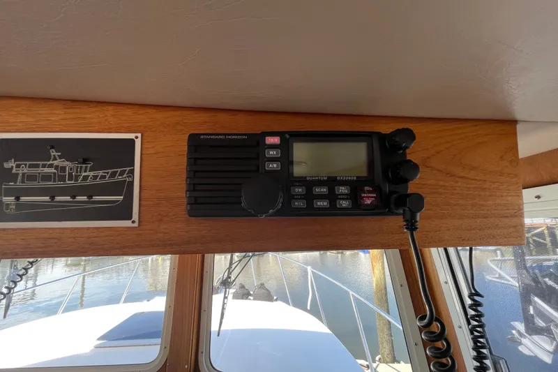 Slide: The Image of Radio equipment on 2003 American Tug 34 boat, featuring Standard Horizon model. - 36