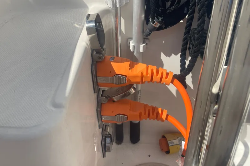 Slide: The Image of Orange power cables connected on a 2003 American Tug 34 boat. - 27