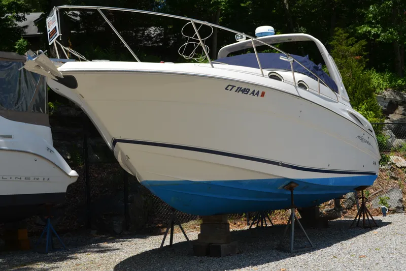 Slide: The Image of 2001 Monterey 282 Cruiser boat on stands, displayed outdoors. - 3