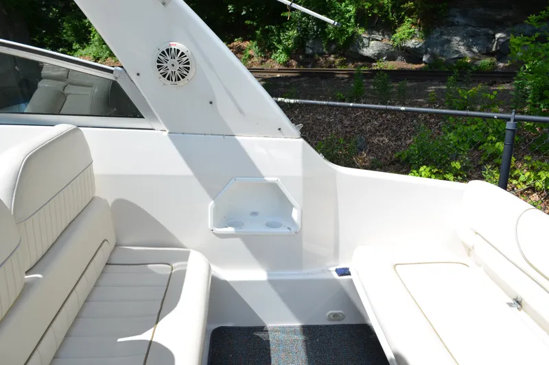 Slide: The Image of Interior of a 2001 Monterey 282 Cruiser boat with white seating and speaker. - 11