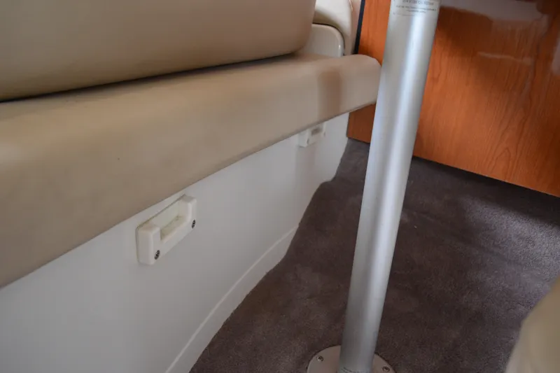 Slide: The Image of Interior of a 2001 Monterey 282 Cruiser showing seating and a metal support pole. - 26