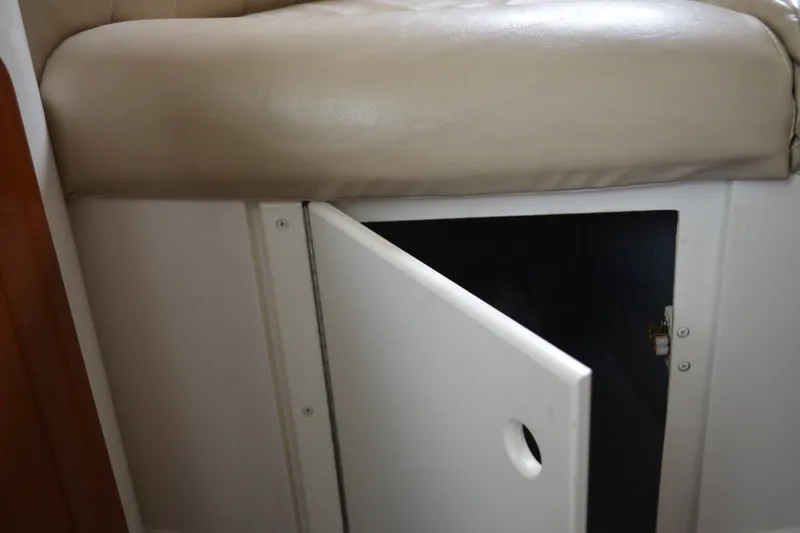 Slide: The Image of Open storage compartment under beige seat in 2001 Monterey 282 Cruiser boat. - 27