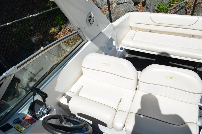 Slide: The Image of 2001 Monterey 282 Cruiser interior with white seating and steering wheel. - 14
