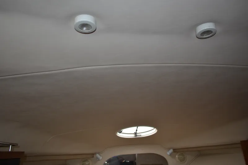 Slide: The Image of Interior ceiling of a 2001 Monterey 282 Cruiser boat with circular lights. - 20