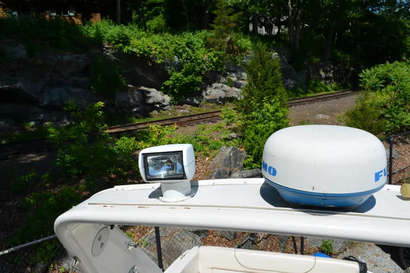 Slide: The Image of Radar and spotlight on 2001 Monterey 282 Cruiser boat, surrounded by lush greenery. - 7