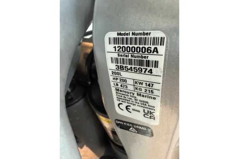Slide: The Image of Label on Mercury Marine engine, showing model and serial numbers, horsepower, and weight details. - 11