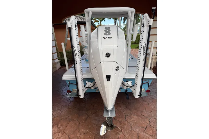 Slide: The Image of Outboard motor on a V-Tech 18 boat, 2025 model, with dual Power-Pole anchors. - 12