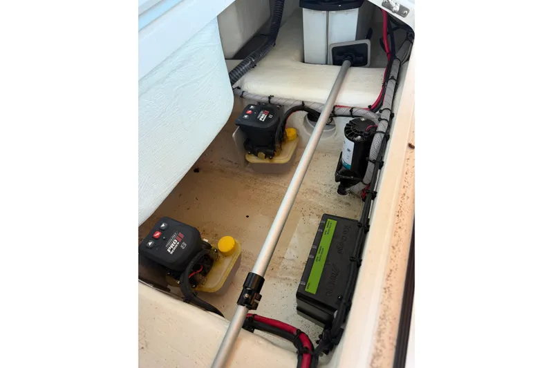 Slide: The Image of Interior view of a 2025 V-Tech 18 model boat's battery and wiring system. - 18