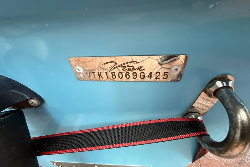 Slide: The Image of Metallic V-Tech 18 model plate with serial number, mounted on a blue surface. - 10