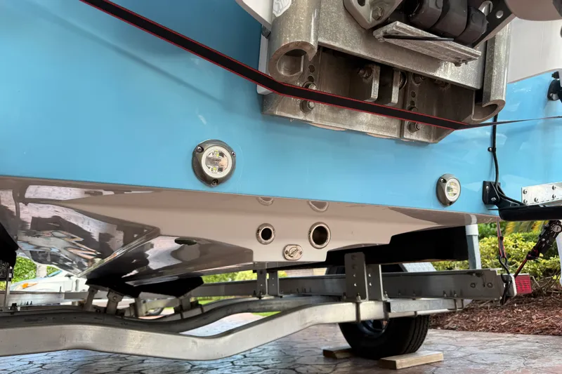 Slide: The Image of Underneath view of a 2025 V-Tech 18 boat on a trailer, showcasing hull details. - 13