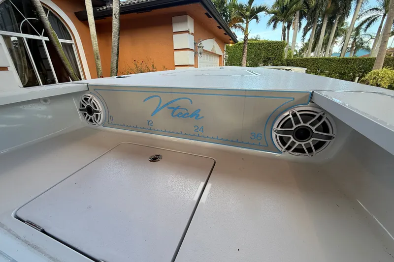 Slide: The Image of V-tech 18 boat interior with speakers, 2025 model, featuring sleek design and measurement markings. - 7