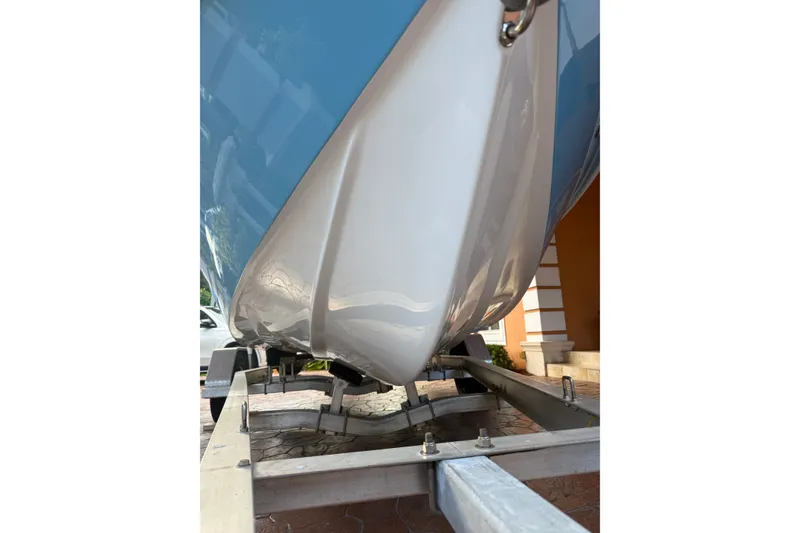 Slide: The Image of 2025 V-Tech 18 boat hull on trailer, showcasing sleek design and craftsmanship. - 2