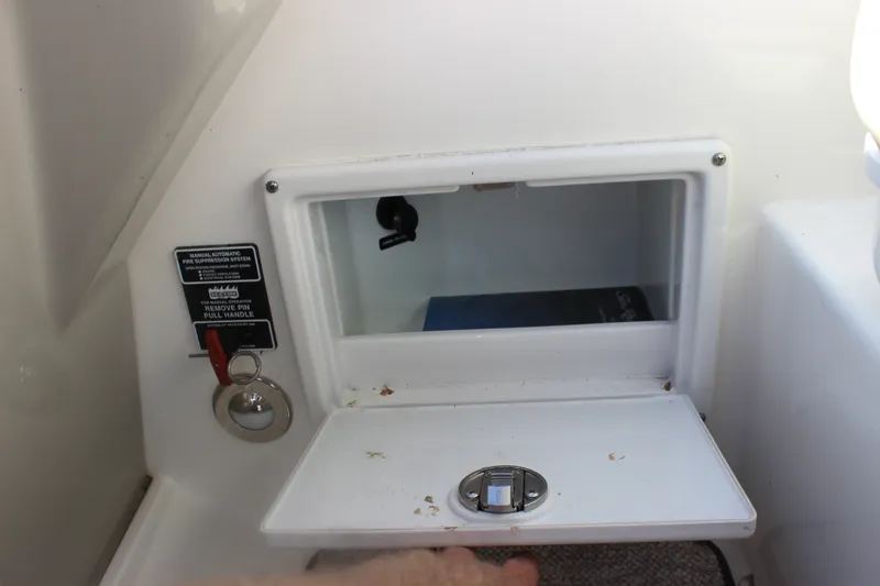 Slide: The Image of Storage compartment on a 2012 Sea Ray Sundancer 280 boat with fire suppression system. - 38