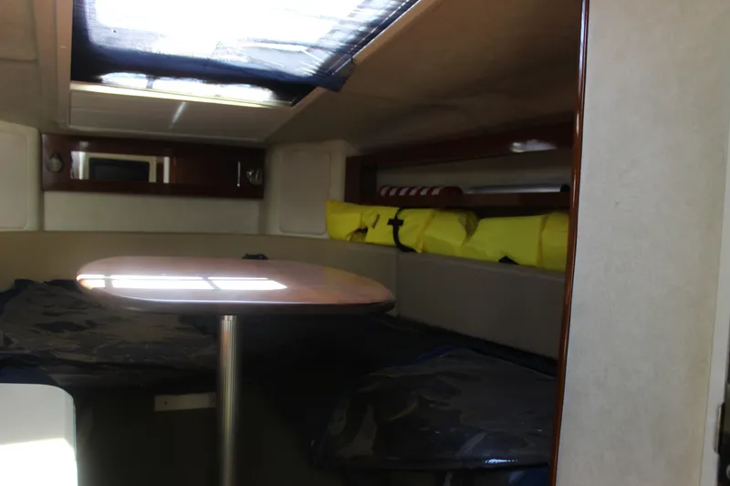 Slide: The Image of Interior cabin of 2012 Sea Ray Sundancer 280 with table and seating. - 29