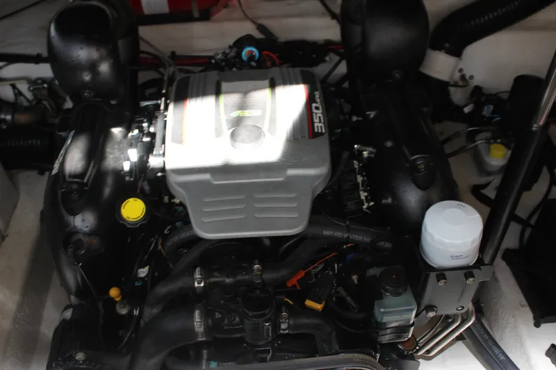 Slide: The Image of Engine compartment of a 2012 Sea Ray Sundancer 280 boat, showcasing detailed components. - 41