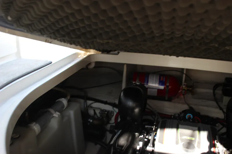 Slide: The Image of Engine compartment of a 2012 Sea Ray Sundancer 280 with visible fire extinguisher. - 40