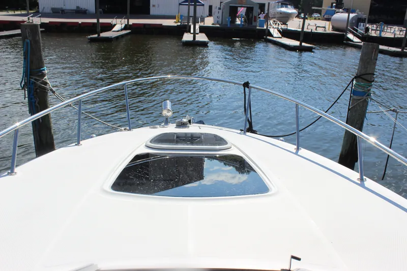 Slide: The Image of 2012 Sea Ray Sundancer 280 yacht docked at marina, view from bow. - 26