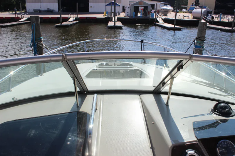 Slide: The Image of 2012 Sea Ray Sundancer 280 boat docked at marina, view from helm. - 25