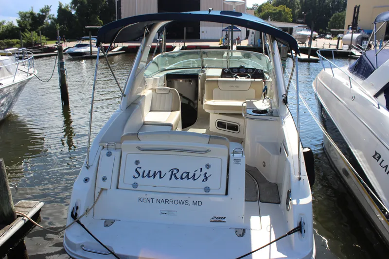 Slide: The Image of 2012 Sea Ray Sundancer 280 docked at marina, rear view with seating area. - 8