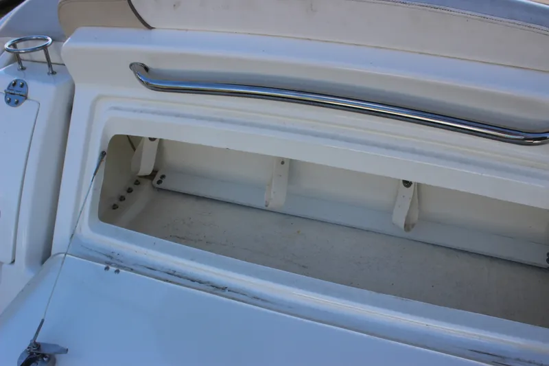 Slide: The Image of Open storage compartment on a 2012 Sea Ray Sundancer 280 boat. - 21
