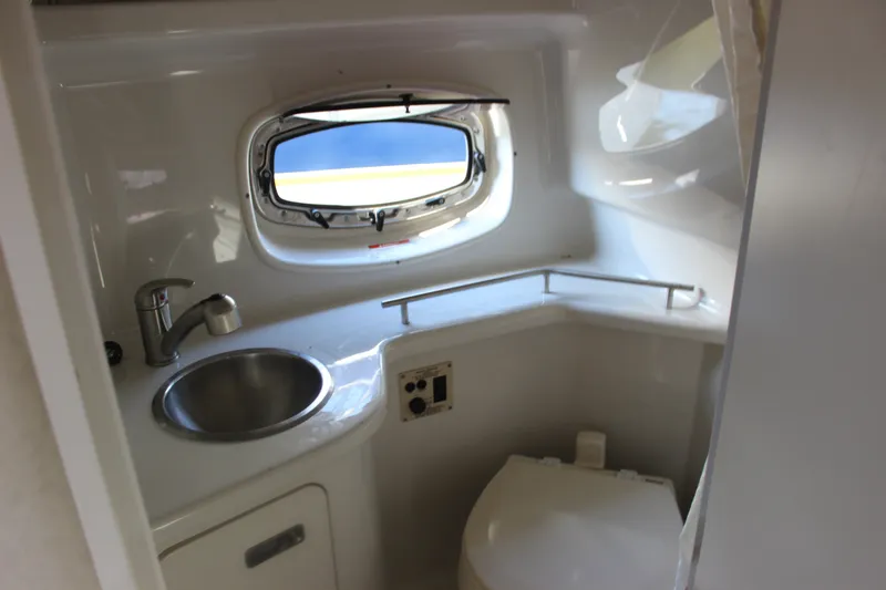 Slide: The Image of Interior of 2012 Sea Ray Sundancer 280 boat bathroom with sink and toilet. - 37