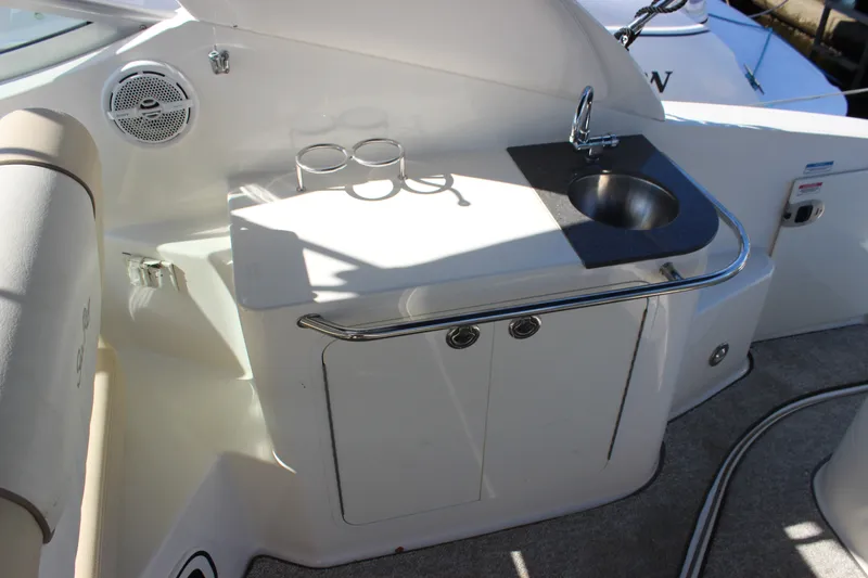 Slide: The Image of Interior of 2012 Sea Ray Sundancer 280 with sink and storage cabinet. - 14