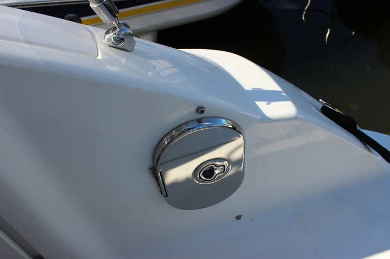 Slide: The Image of Fuel cap on a 2012 Sea Ray Sundancer 280 boat, close-up view. - 18