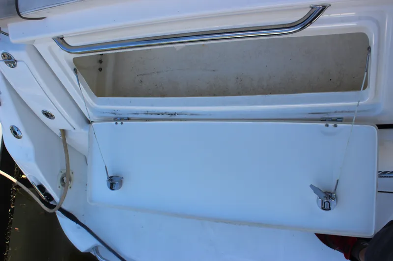 Slide: The Image of Open storage compartment on a 2012 Sea Ray Sundancer 280 boat. - 20