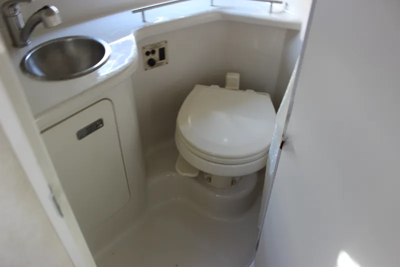Slide: The Image of Compact bathroom in 2012 Sea Ray Sundancer 280 yacht with sink and toilet. - 36